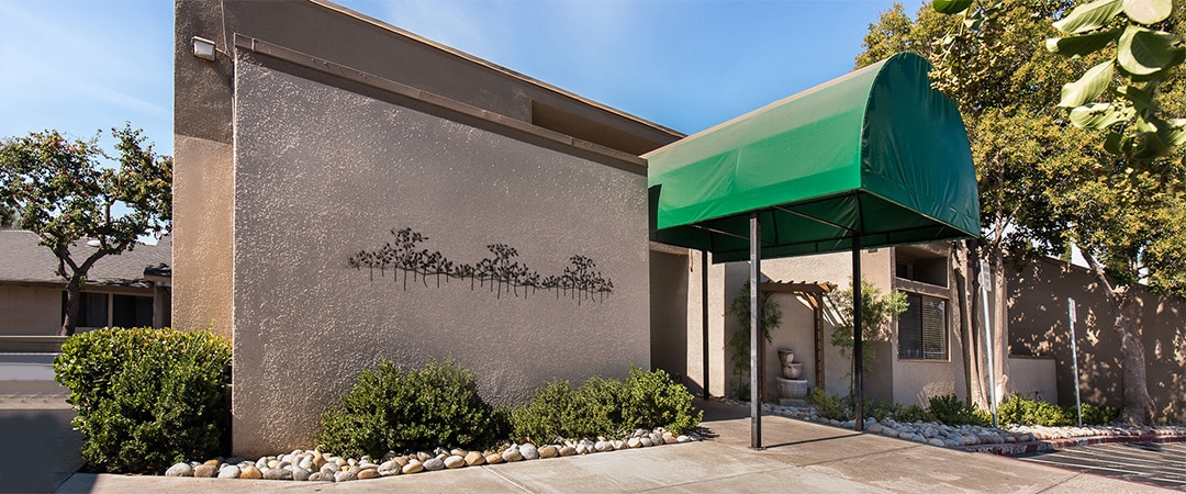 The front of the Diablo Valley facility showing an awning and shade trees