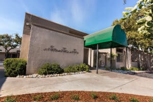 The front of the Diablo Valley facility showing an awning and shade trees